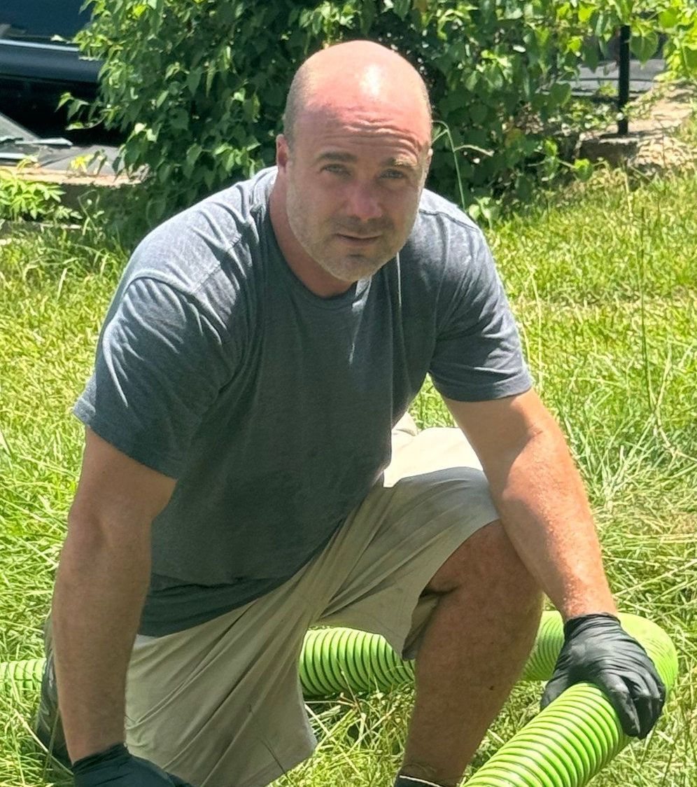 Jay Hancock pumping a septic tank