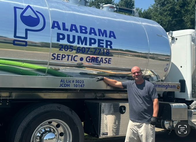 Alabama Pumper Owner Jay Hancock standing in front of branded septic and grease pumping service truck in Birmingham Alabama.