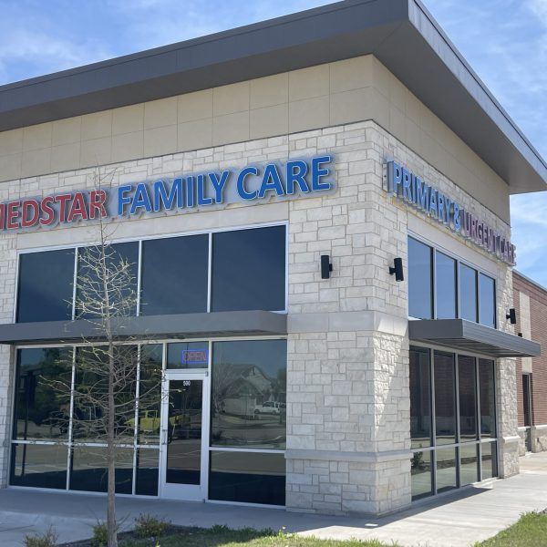 A brick building with the word family care on it