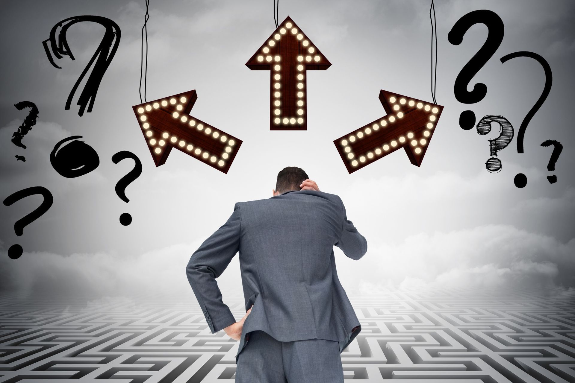 Man in suit, hand on head, facing three arrows pointing in different directions, surrounded by question marks above a maze.
