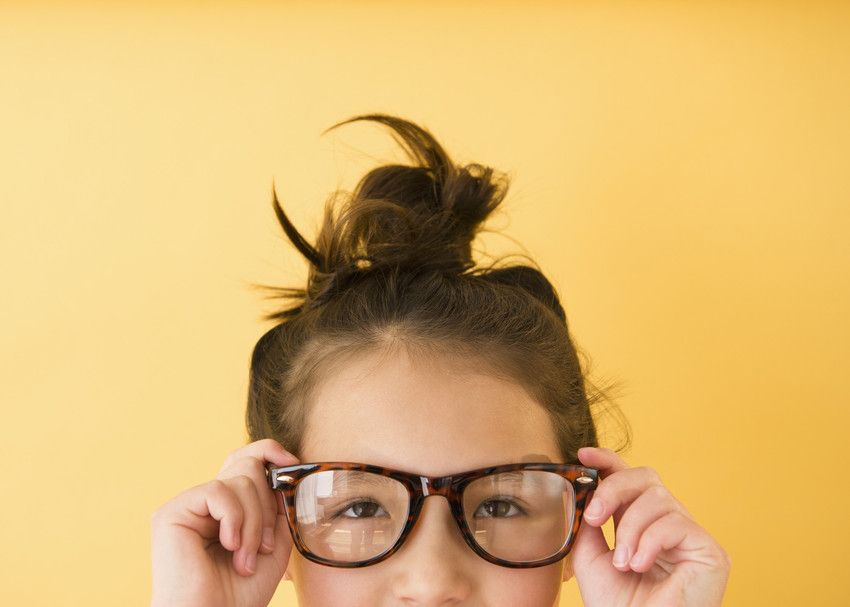 Mixed race girl wearing glasses