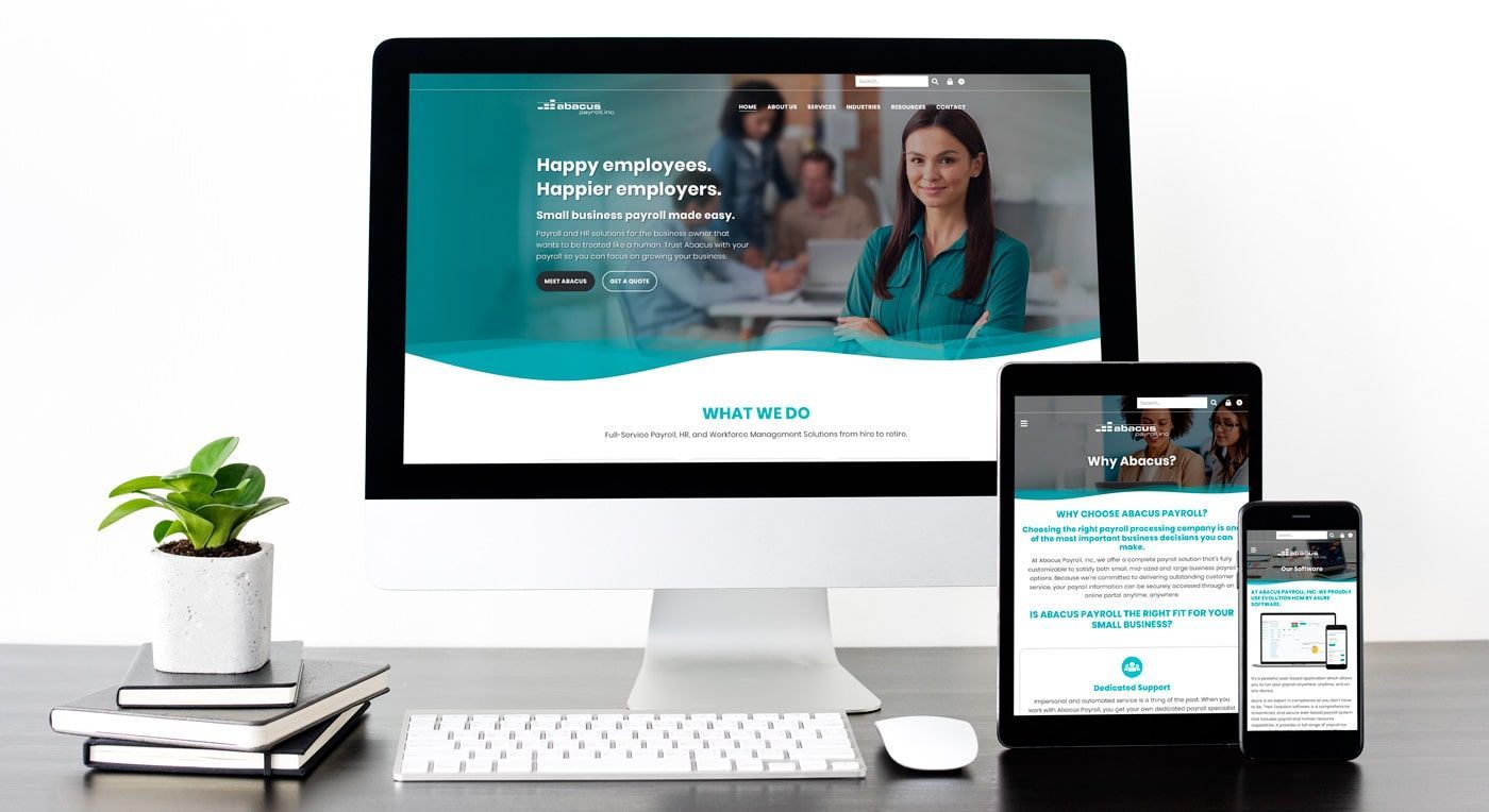 Abacus Payroll website mocked up on different screens.