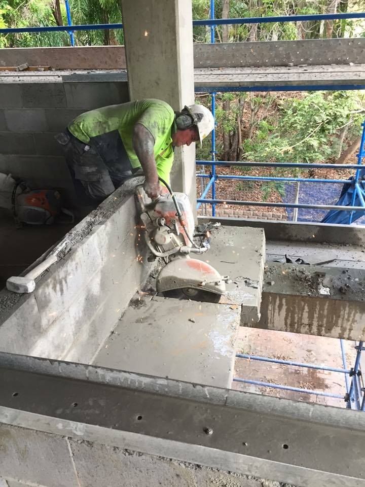 Construction Worker Cutting Concrete With a Saw — Dondarra Concrete Cutting & Drilling in Parkhurst, QLD