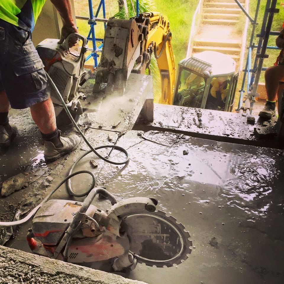Construction Worker Cutting Concrete With a Saw — Dondarra Concrete Cutting & Drilling in Parkhurst, QLD