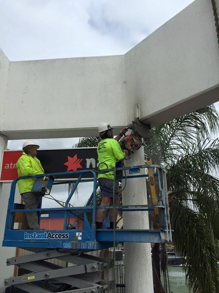 Two Workers on a Lift Sawing Into a Concrete Structure — Dondarra Concrete Cutting & Drilling in Parkhurst, QLD