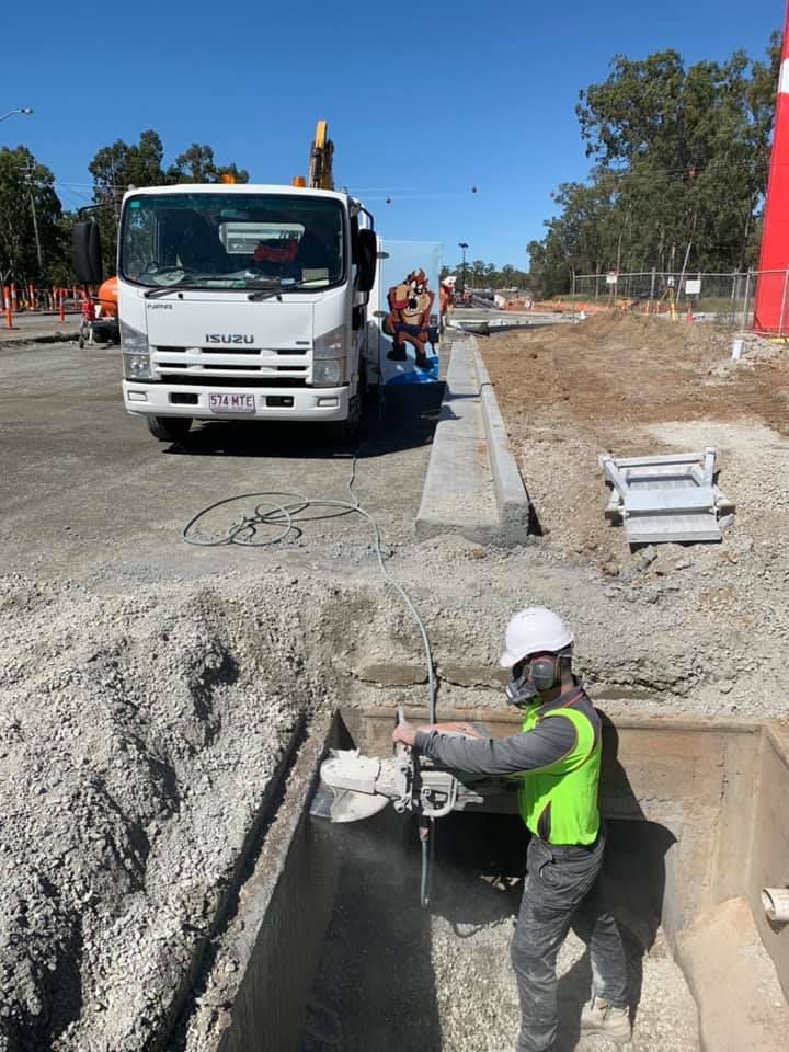 Construction Worker Using a Saw to Cut Concrete — Dondarra Concrete Cutting & Drilling in Parkhurst, QLD