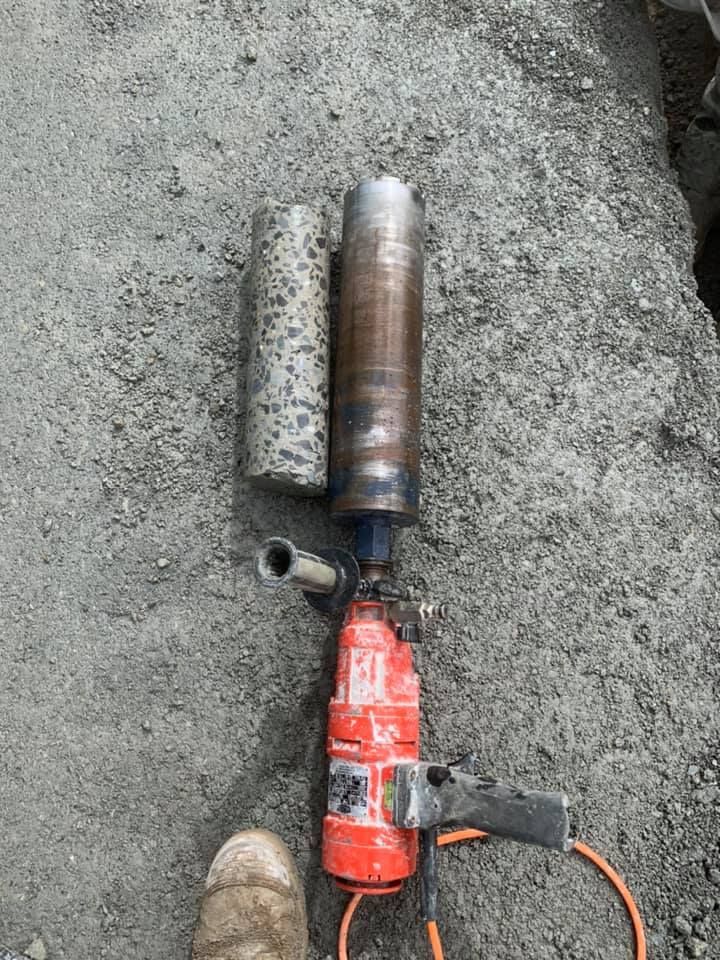 Worker Using a Saw to Cut Concrete Indoors — Dondarra Concrete Cutting & Drilling in Parkhurst, QLD
