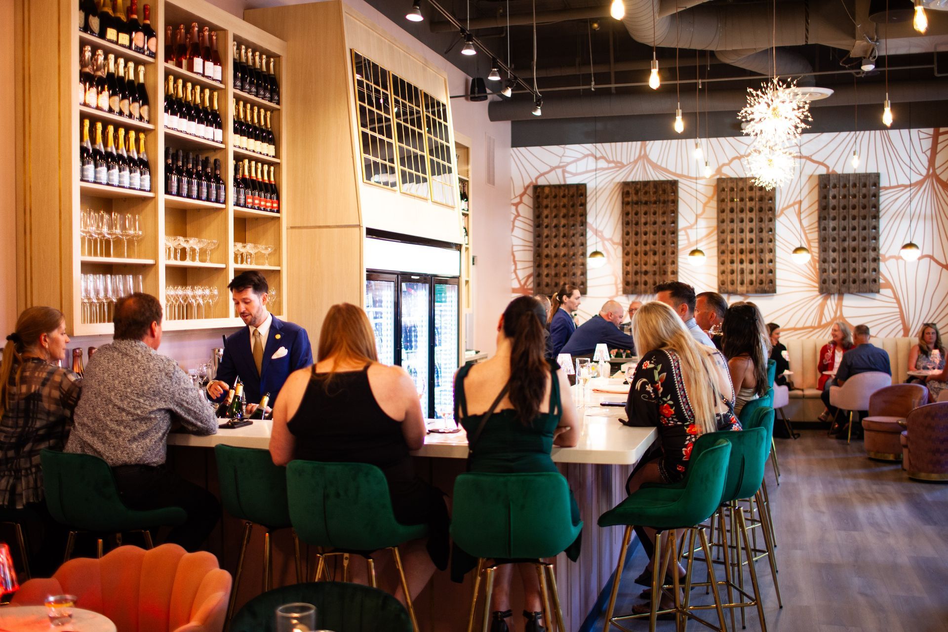 People sitting at a champagne bar at fizz walnut creek.