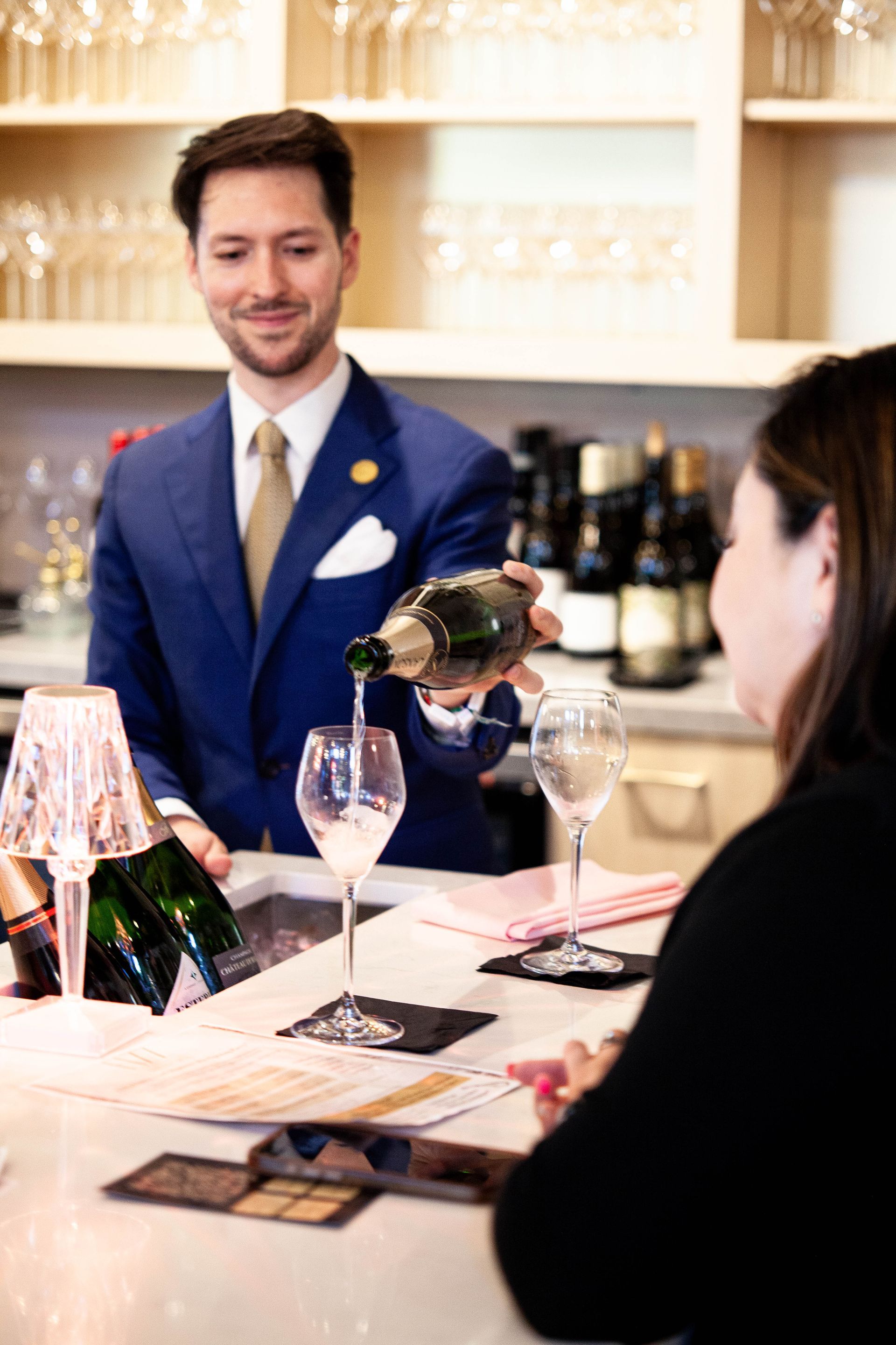 Champagne being poured into a glass. 