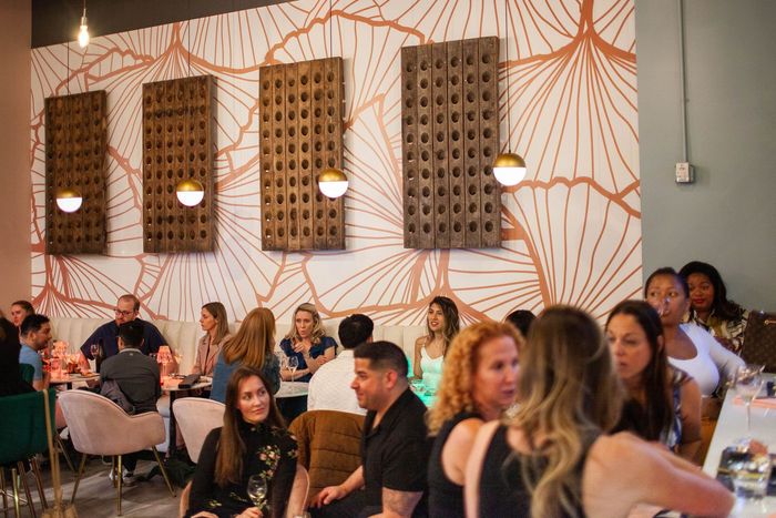 Guests sitting inside fizz walnut creek champagne and bubbles bar.