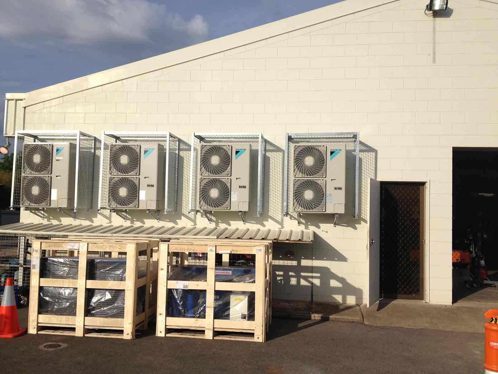 A Building With A Lot Of Air Conditioners On It — Climatech In Maroochydore, QLD