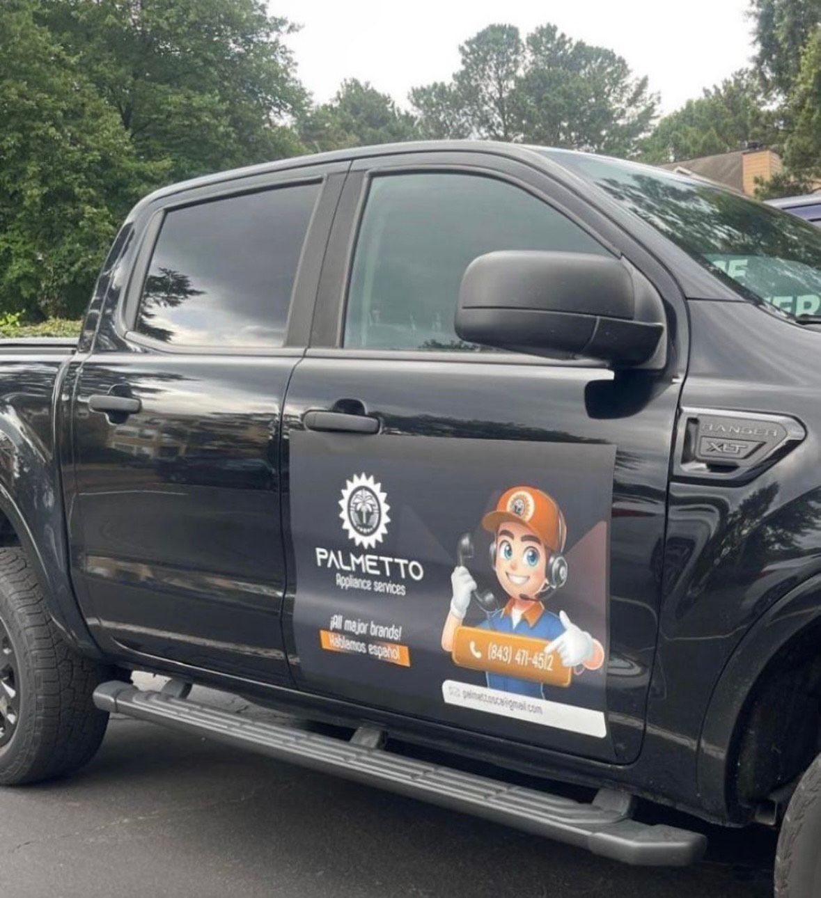 A black truck with palmetto written on the side