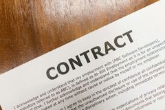 A close-up of a contract titled