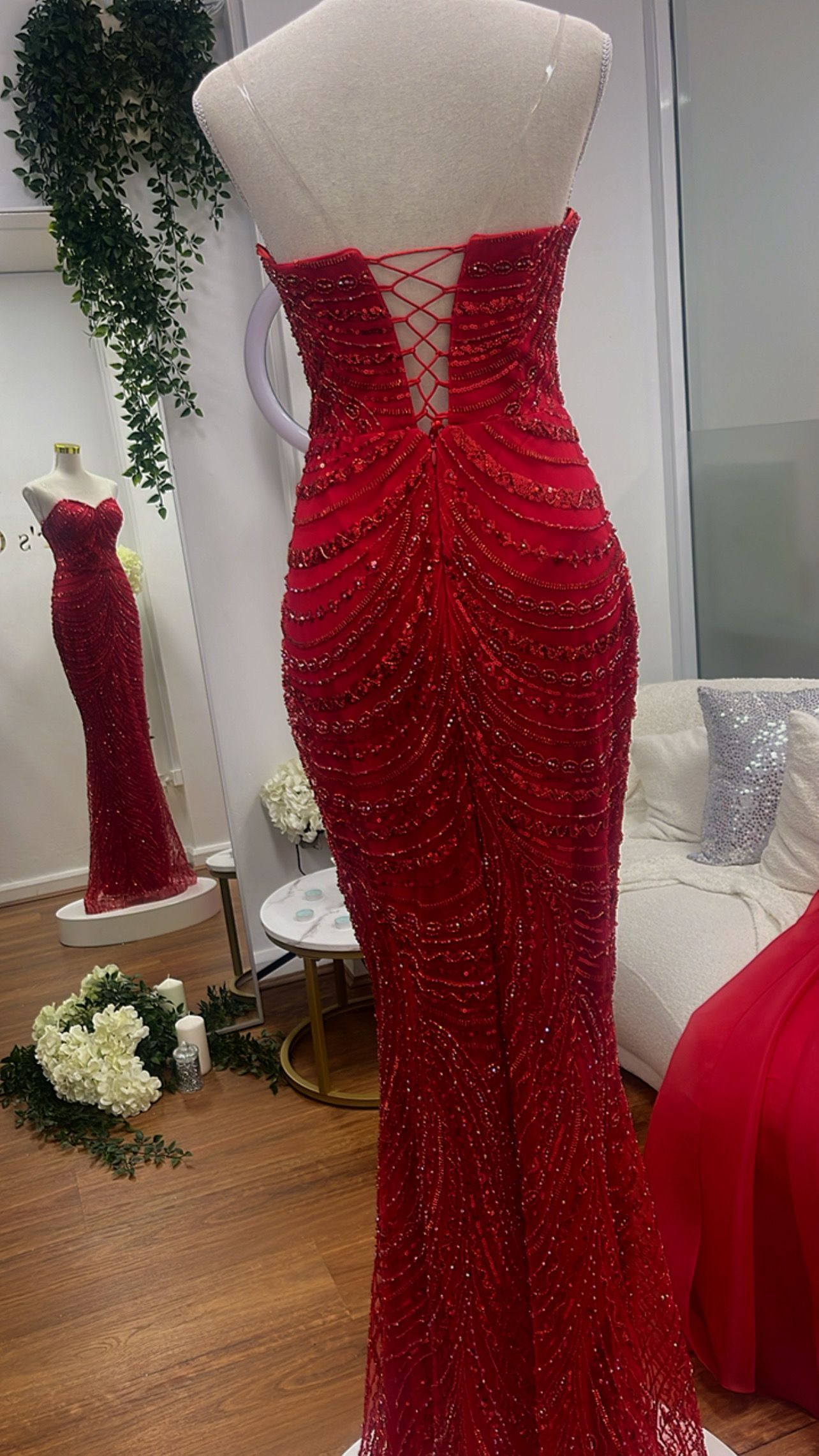 A Woman in A Red Satin Dress Is Standing in Front of A Mirror — Nur's Collection In Rockdale, NSW