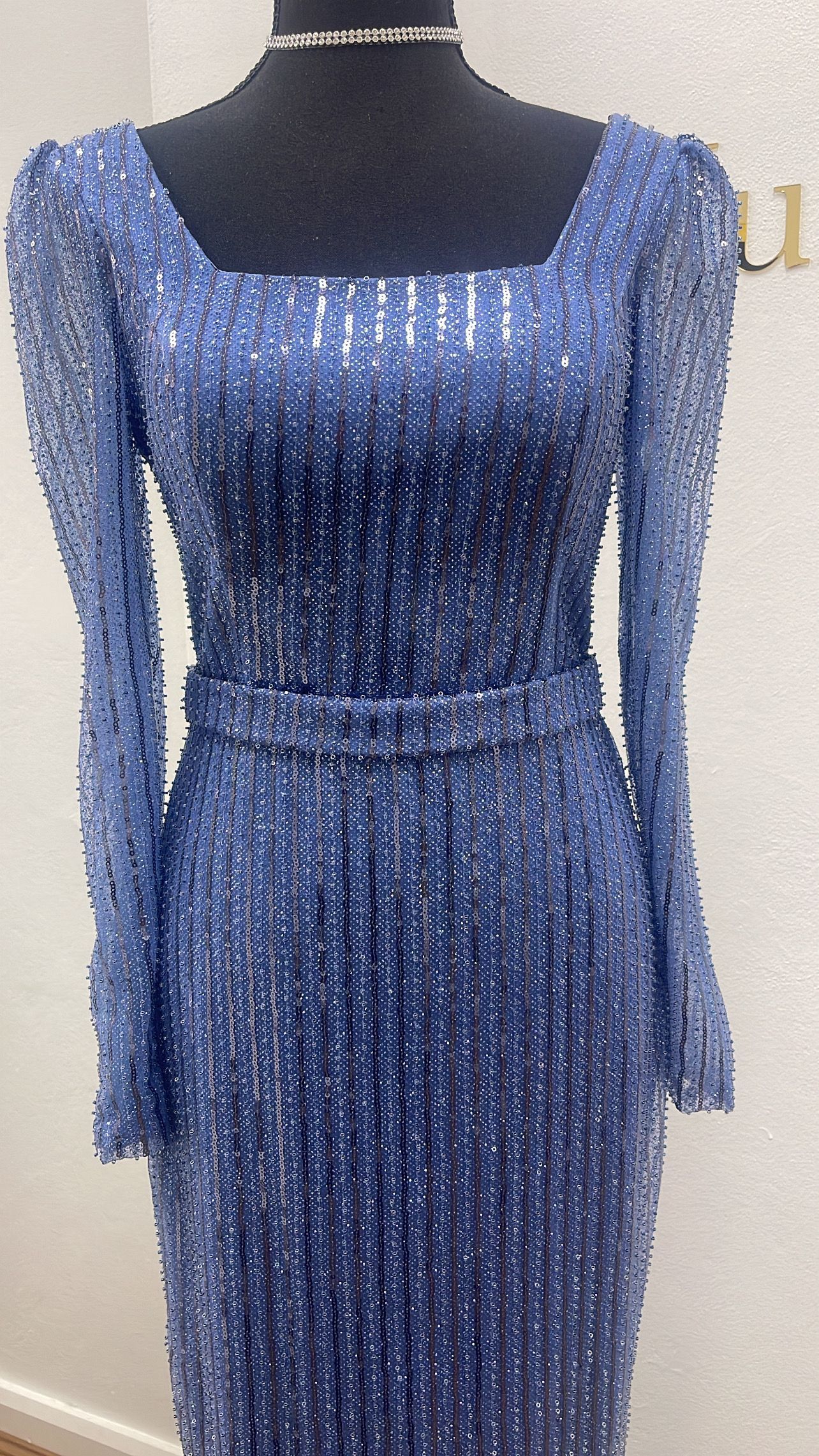 Navy sequin formal dress with square neckline, long sleeves, and belt on a mannequin β Nur's Collection In Rockdale, NSW