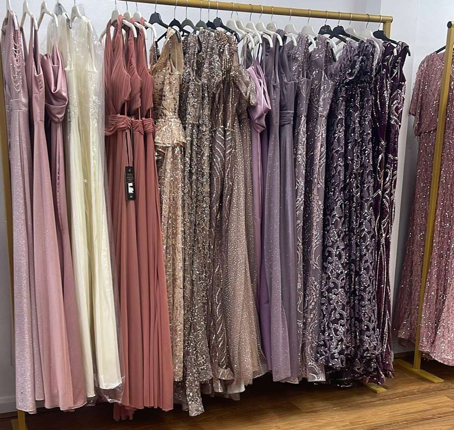 A Bunch of Dresses Are Hanging on a Rack in a Room — Nur's Collection In Rockdale, NSW