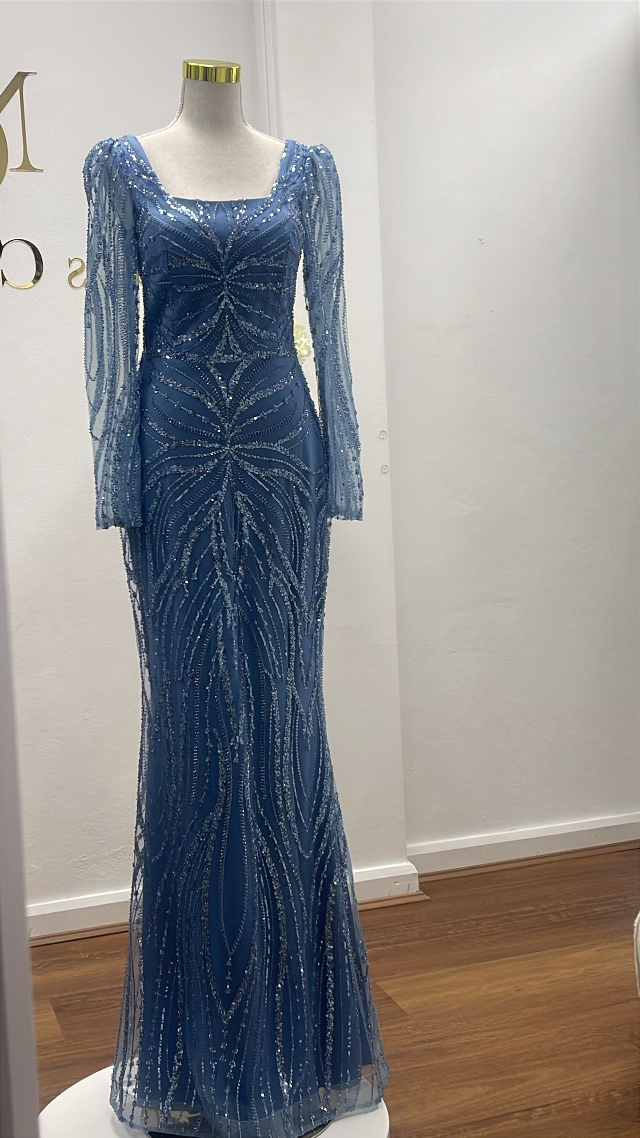 Blue sequined formal gown on a mannequin. Long-sleeved, square neckline, floor-length - Nur's Collection In Rockdale, NSW