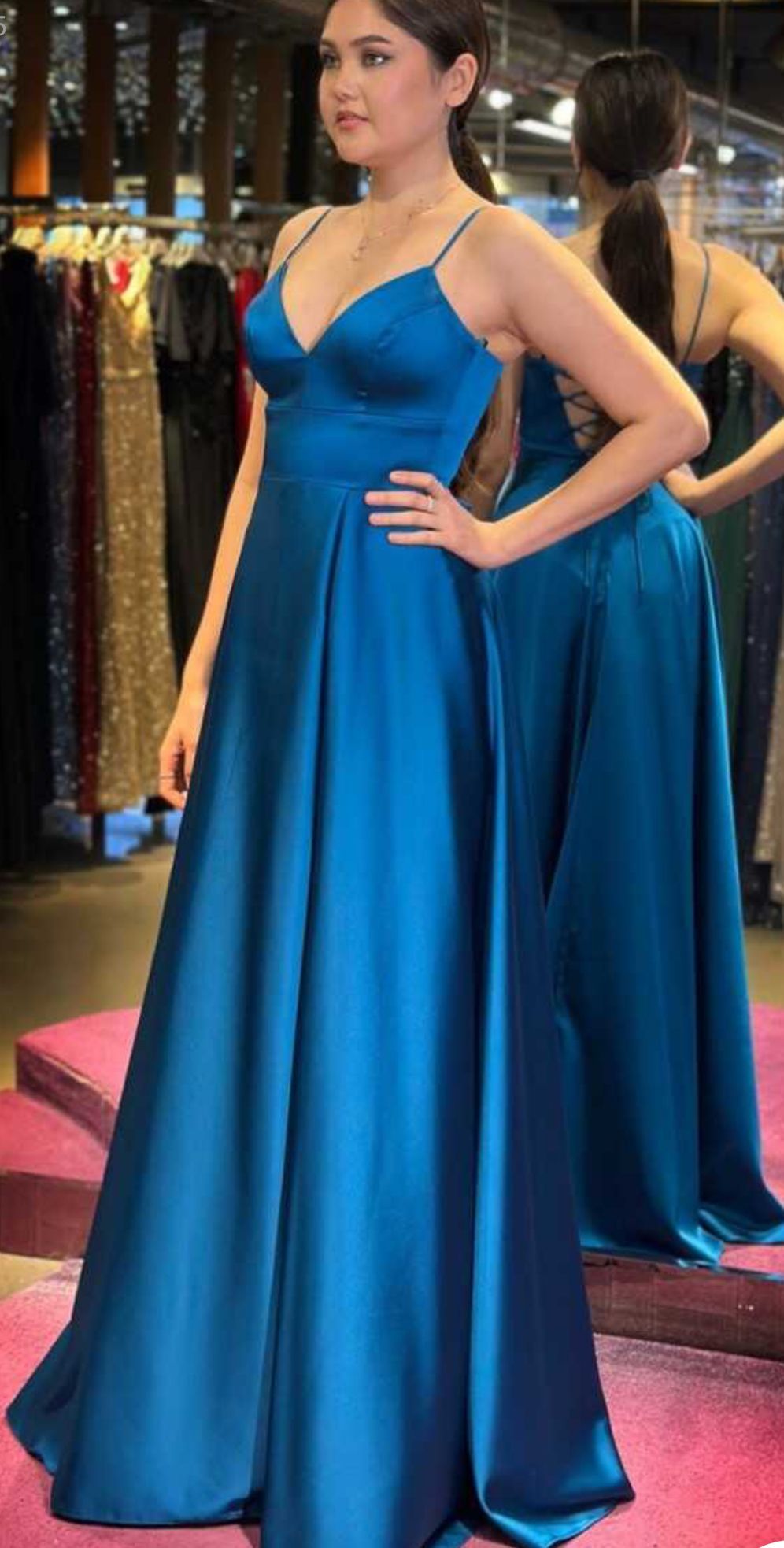 A Woman in a Blue Dress is Standing in Front of a Mirror β Nur's Collection In Rockdale, NSW