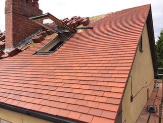 window amidst tile roof