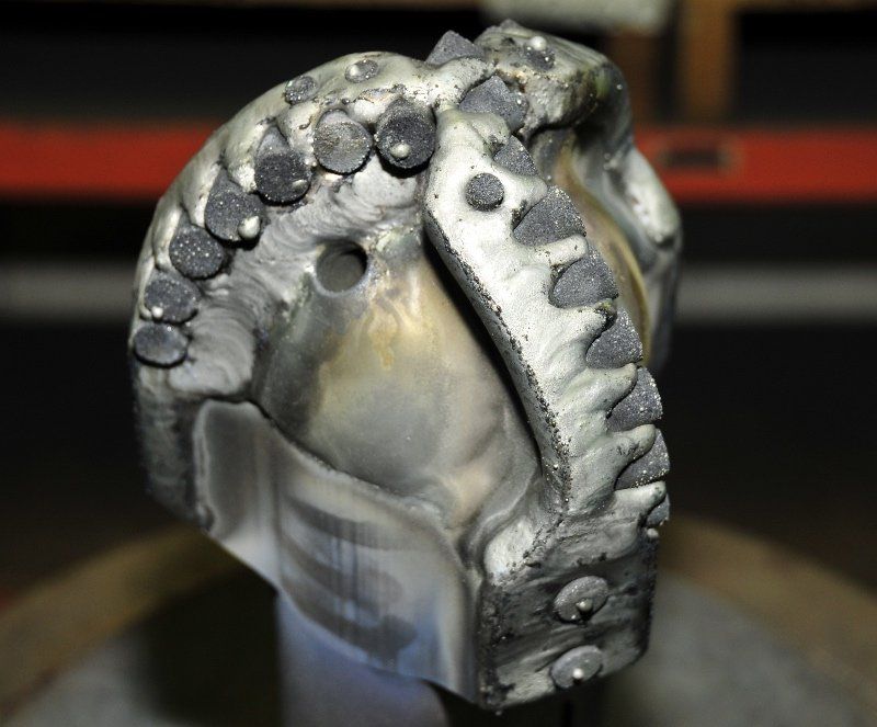 A close up of a metal object with a hole in the middle