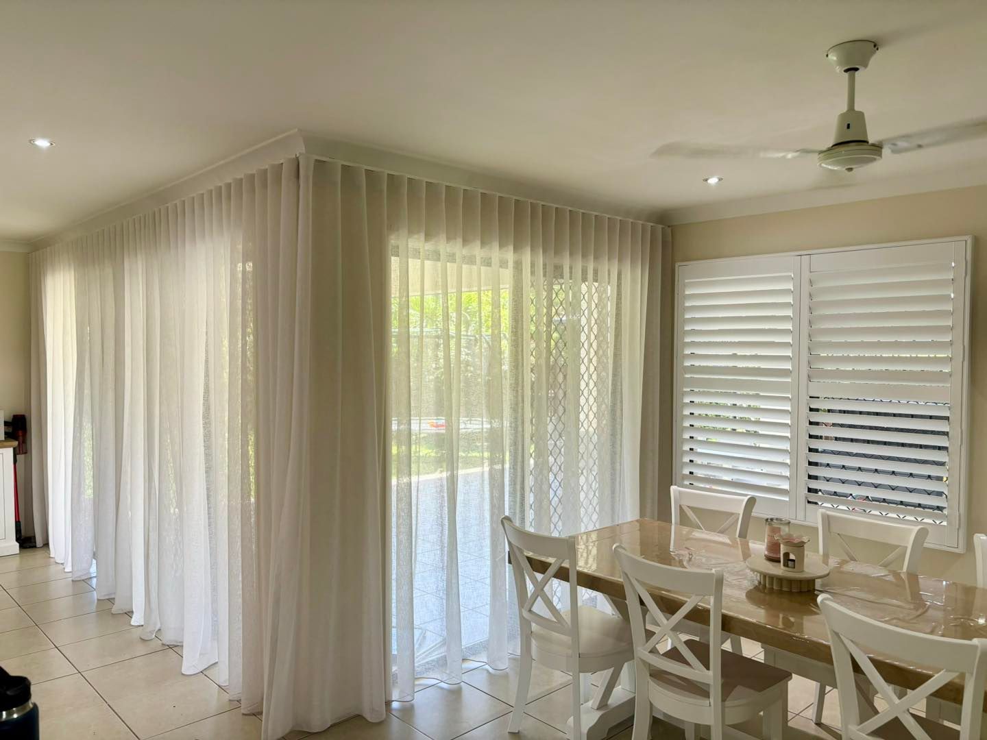 Curtains hanging in a kitchen — Window Coverings in Currajong, QLD