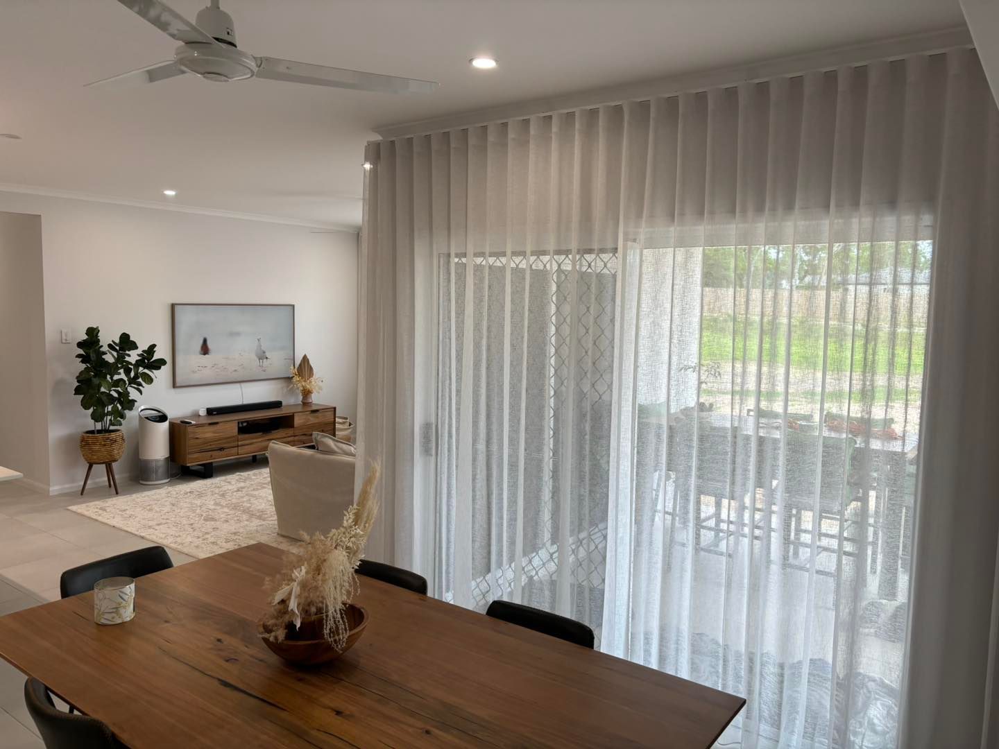 Sheer curtains inside a bedroom — Window Coverings in Currajong, QLD