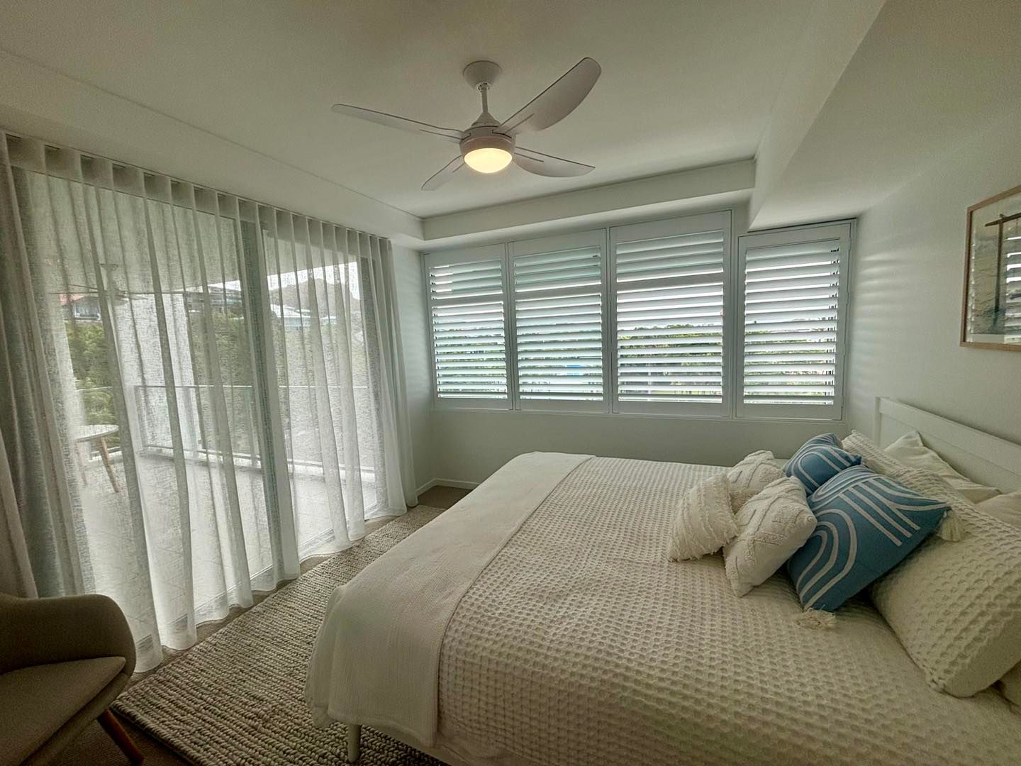 Curtains inside a bedroom — Window Coverings in Currajong, QLD