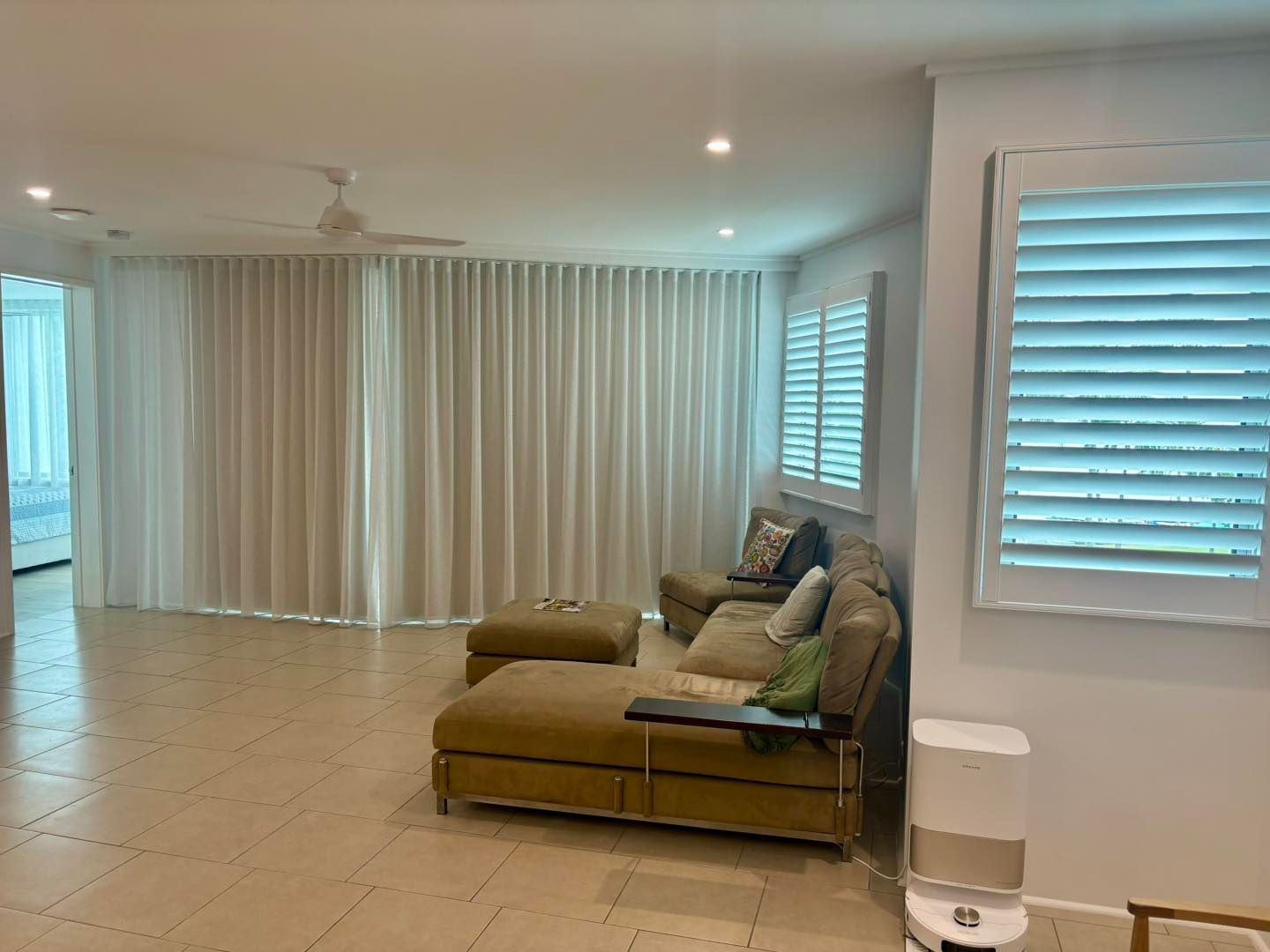 S wave curtains inside a bedroom — Window Coverings in Currajong, QLD