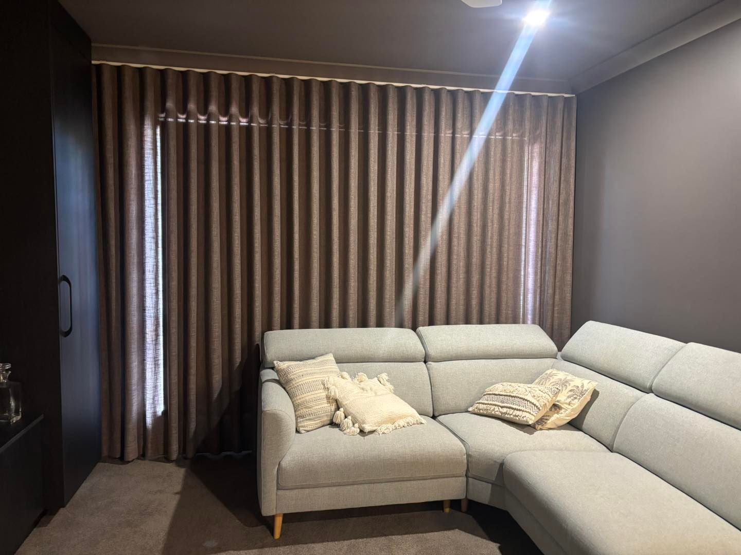 Blockout curtains inside a bedroom — Window Coverings in Currajong, QLD