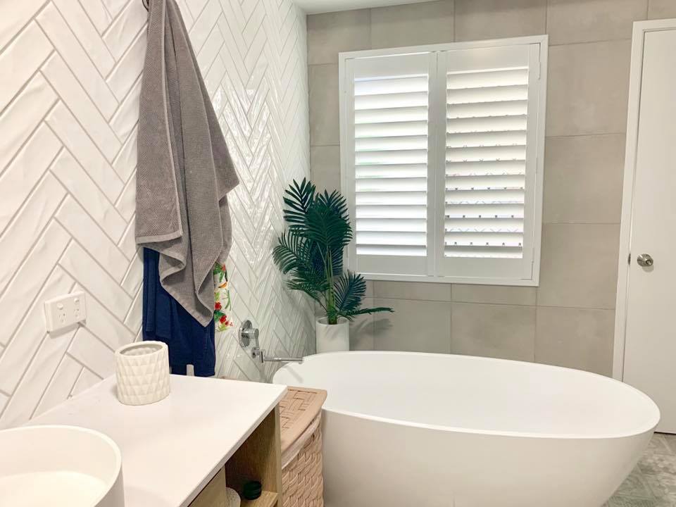 Wooden Shutters on Bathroom Window — Window Coverings in Currajong, QLD
