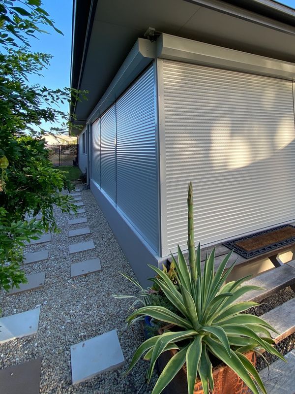 House Secured With Roller Shutters — Window Coverings in Currajong, QLD