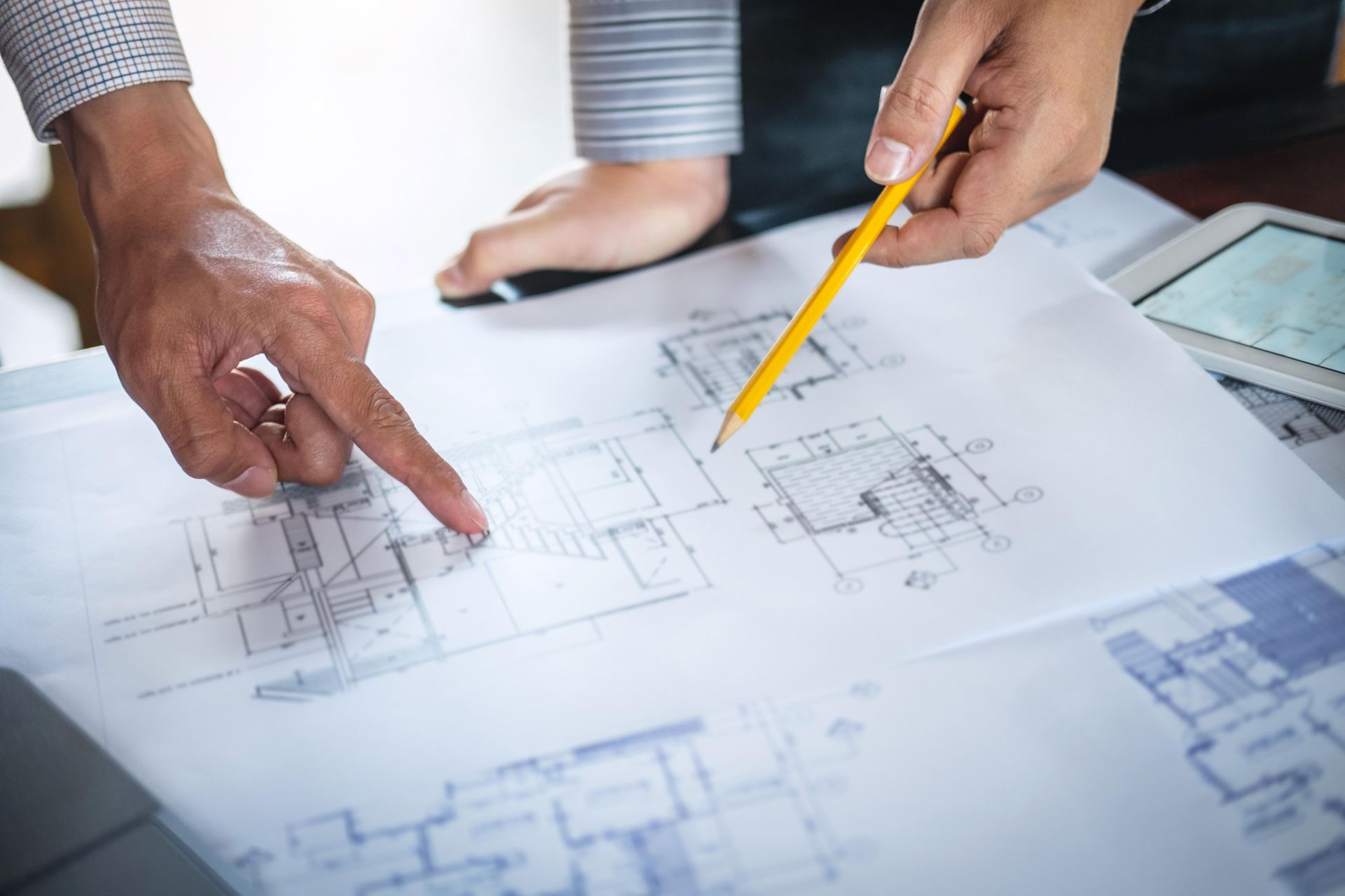 A homeowner shaking hands with a cabinet installer