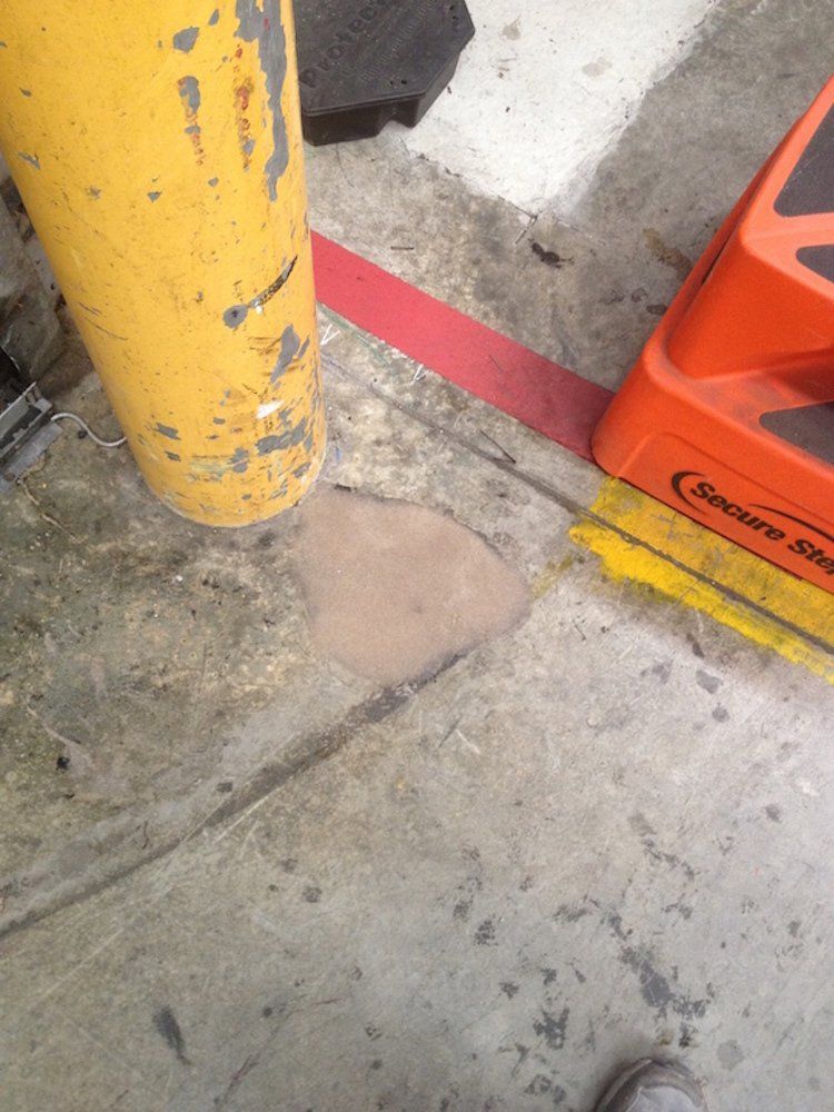 a yellow pole is next to an orange step stool
