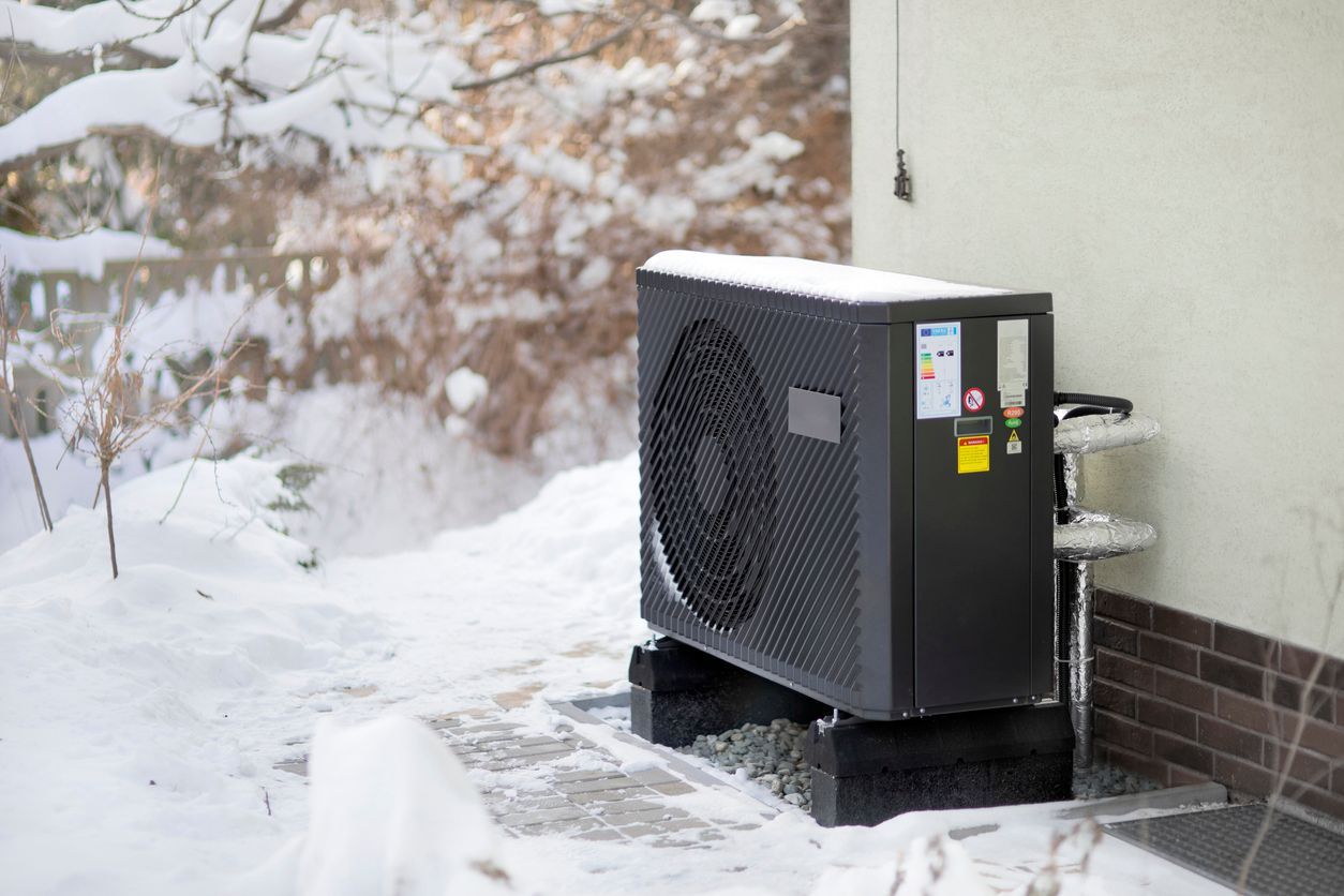 Air source heat pump in winter conditions after Hoffner Heating & Air Conditioning Installation.