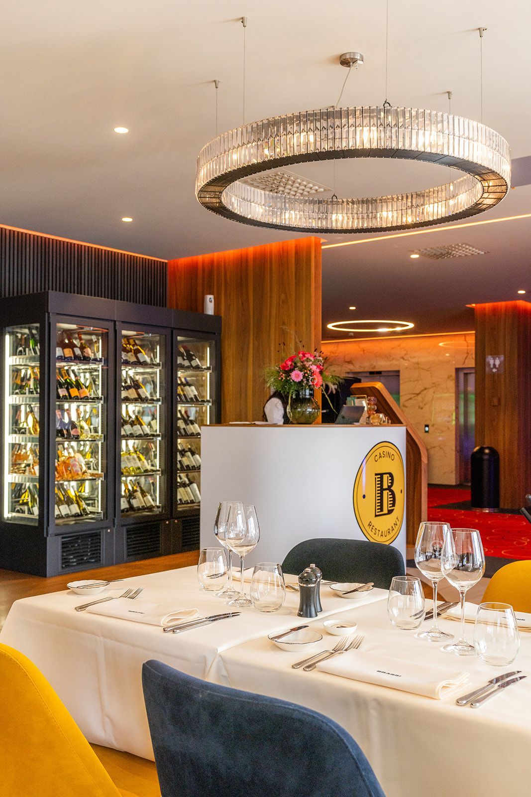 Fresh, raw scallops in their shells resting on a bed of crushed ice.