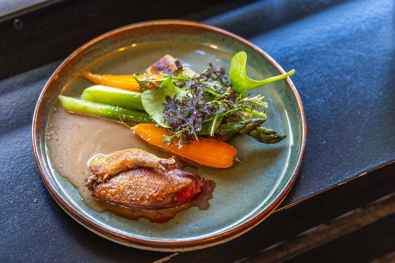 Fresh, raw scallops in their shells resting on a bed of crushed ice.