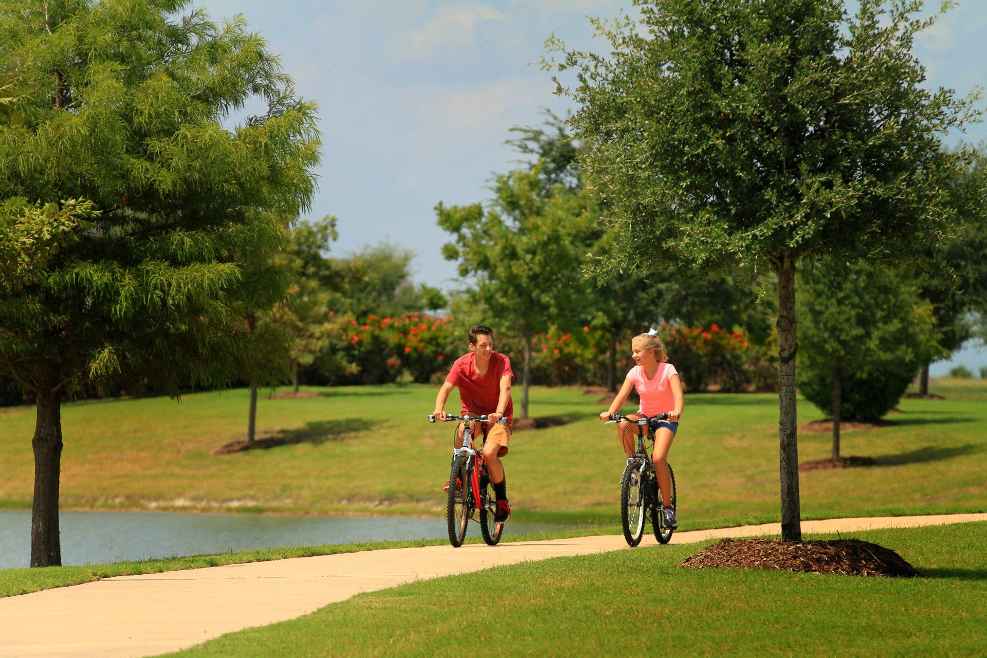 Couple Biking on Devonshire Community Path | Devonshire Living | Forney, TX 75126