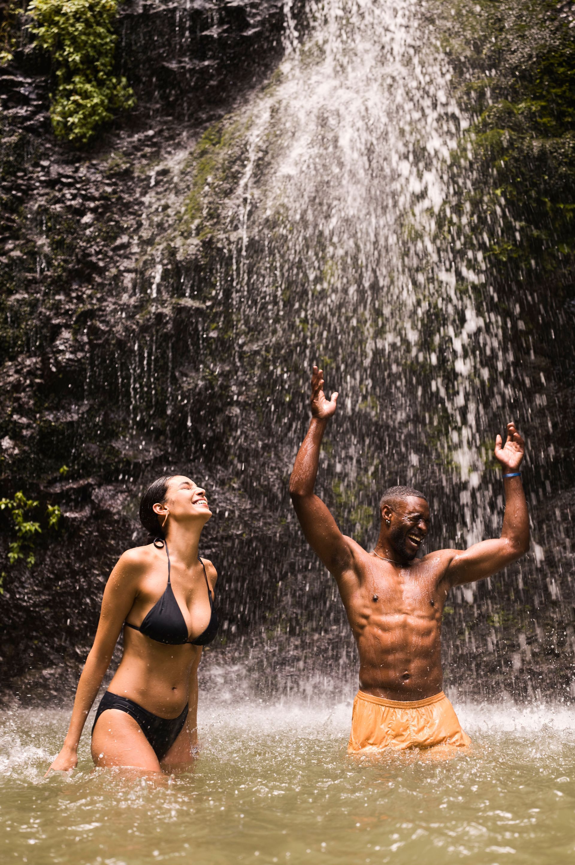 Royal Caribbean cruise ad: Kids swimming in ocean. 60% off second guest + kids sail free offer.