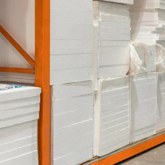 A bunch of styrofoam boxes are stacked on top of each other