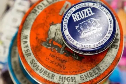 Two round hair pomade tins: orange 