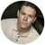 A man in a polo shirt is looking at the camera in a circle.