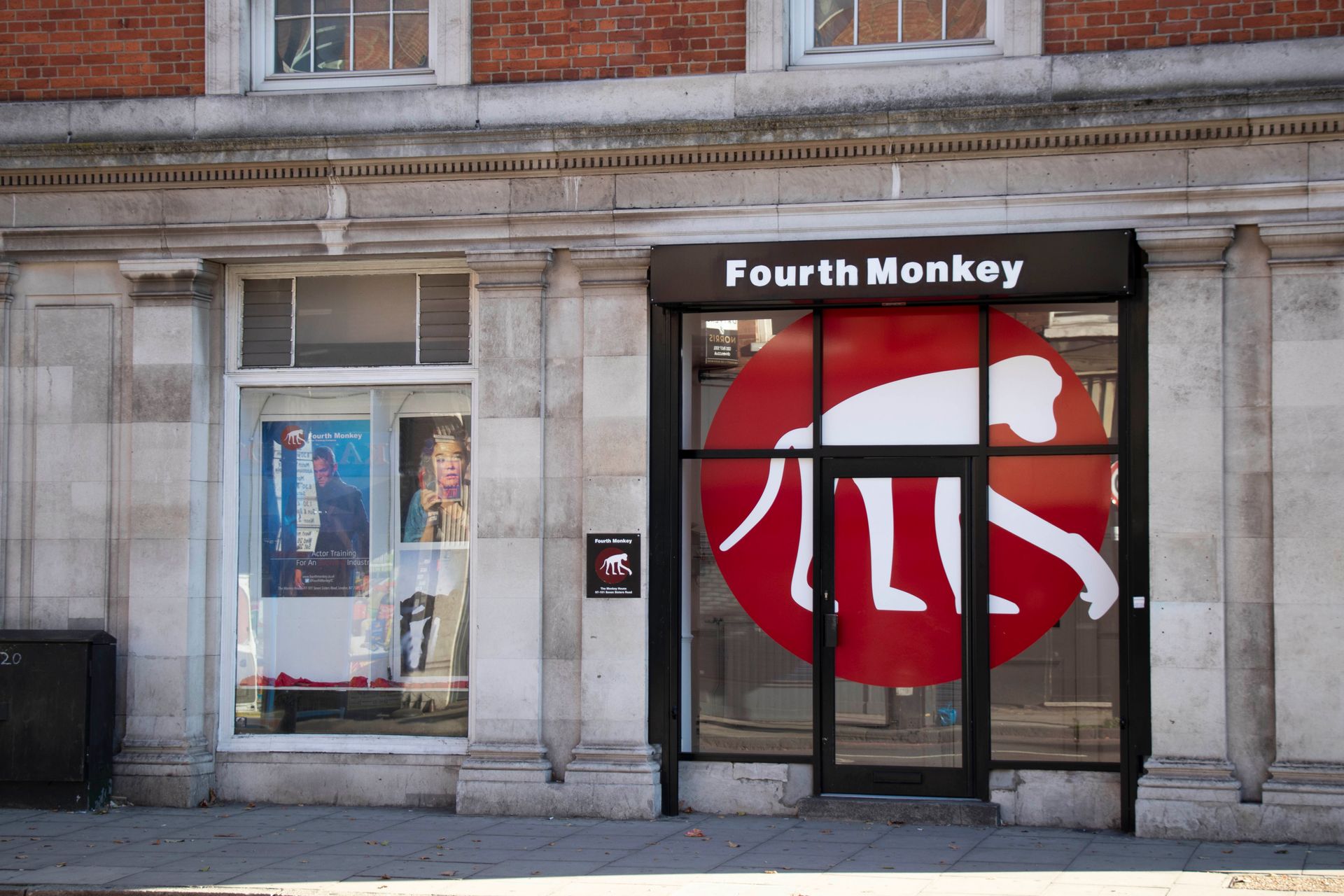 A store front for fourth monkey with a red sign