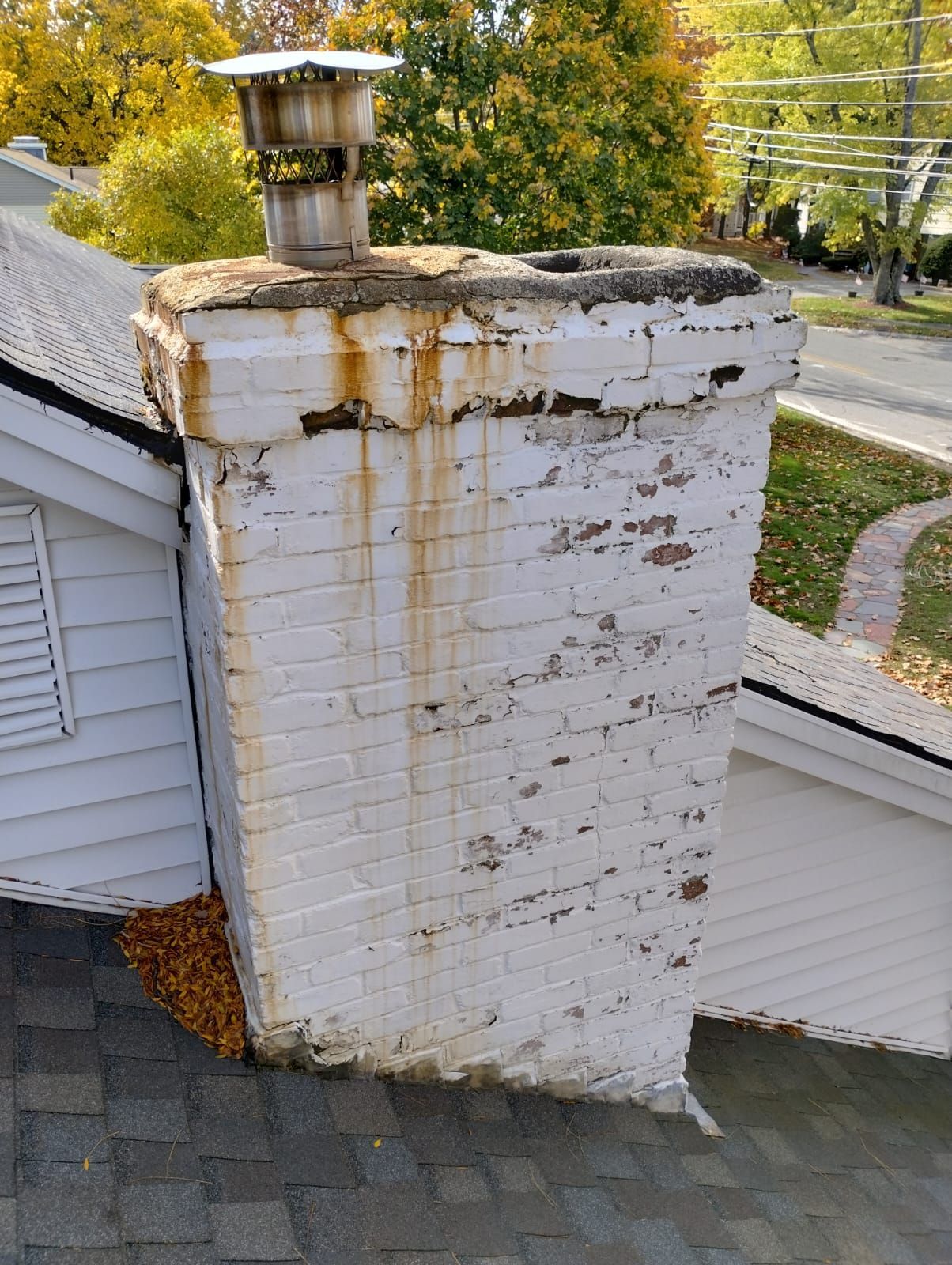 Brick chimney on the side of a house