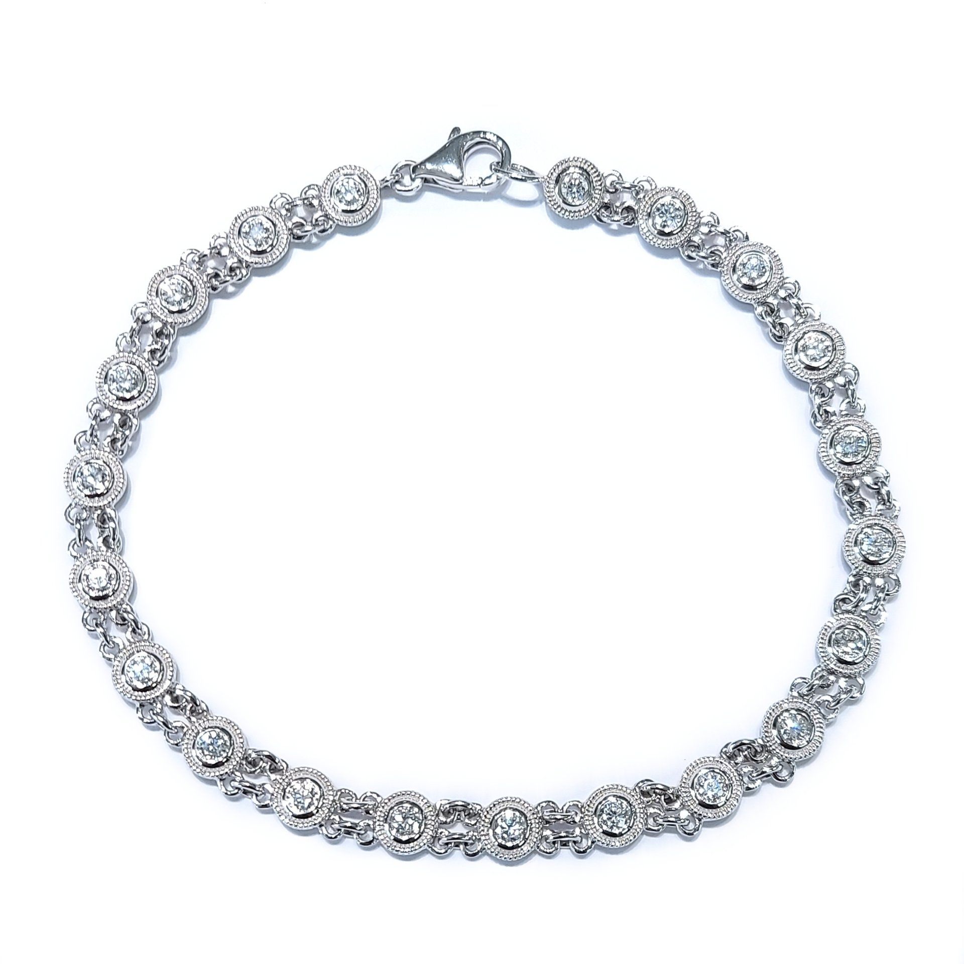 A silver bracelet with diamonds on a white background