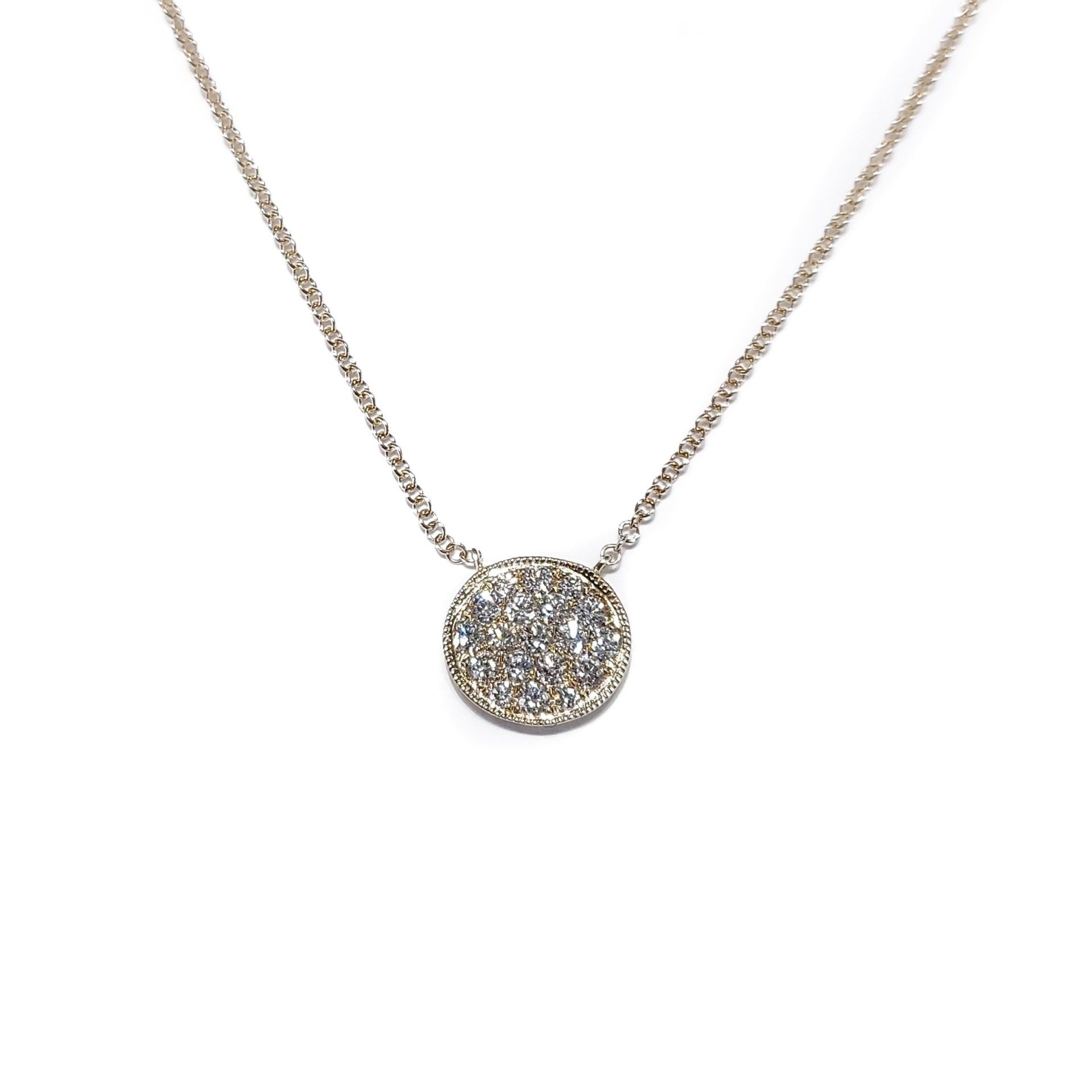 A necklace with a round pendant on a chain