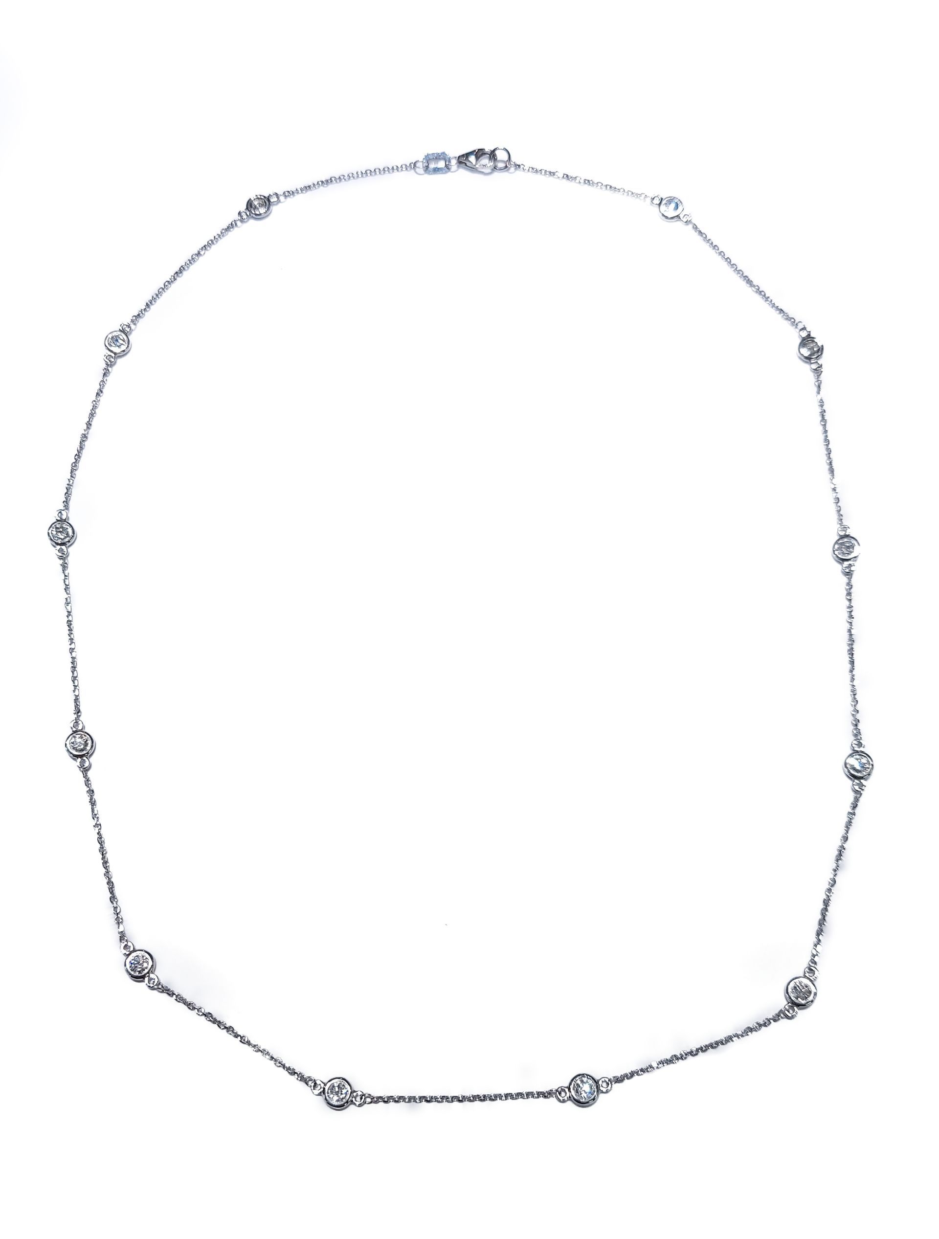 A silver necklace with diamonds on a white background.