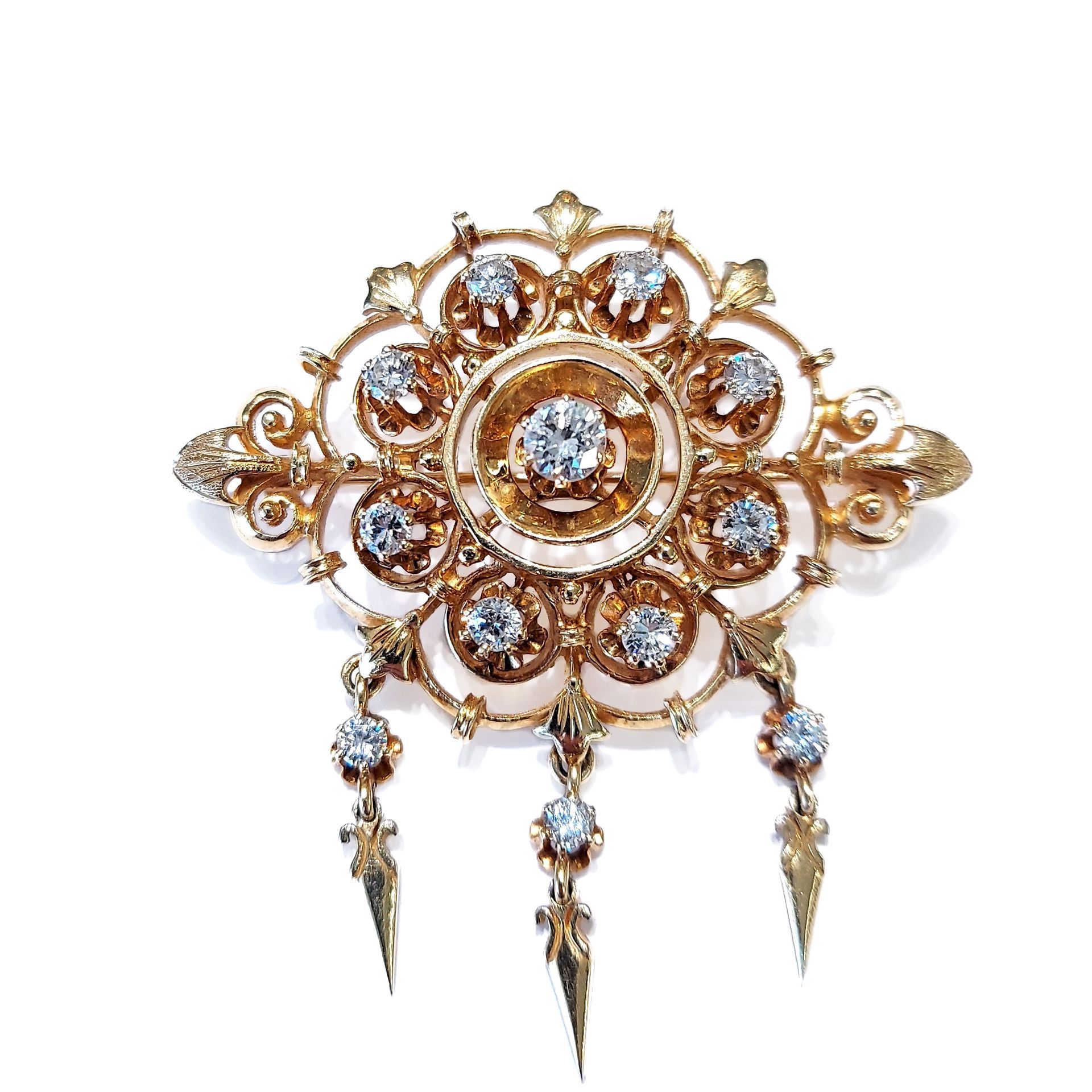 A gold brooch with diamonds on a white background