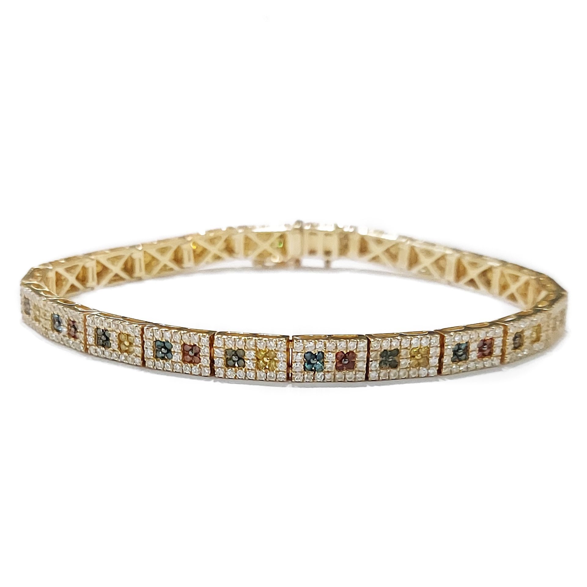 A gold bracelet with a row of colored stones and diamonds