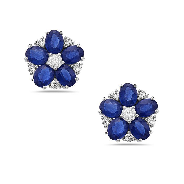 A pair of sapphire and diamond stud earrings in the shape of a flower.