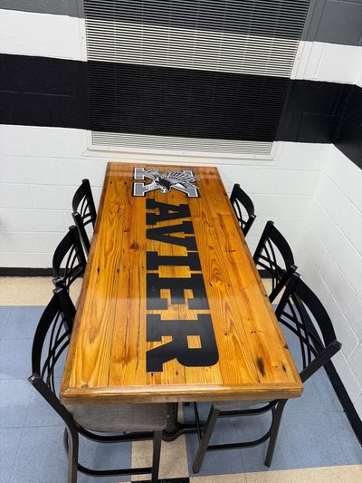CareVet of Shoreline sign in blue and green on a gray wall. Below, a small table with a stuffed animal.